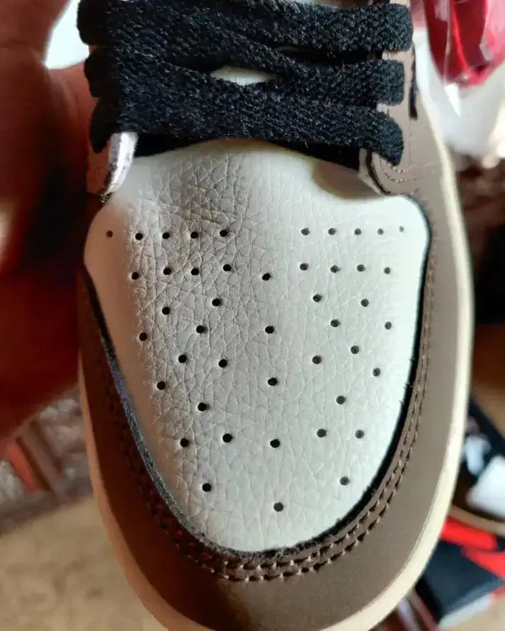 Travis Scott X Nike Air Jordan 1 High Cactus Jack Mocha sneaker close-up, showcasing premium leather upper and unique design.